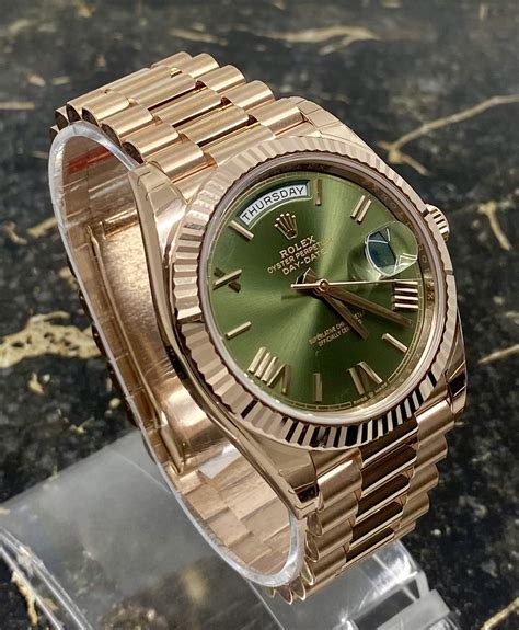 gold and green rolex day date